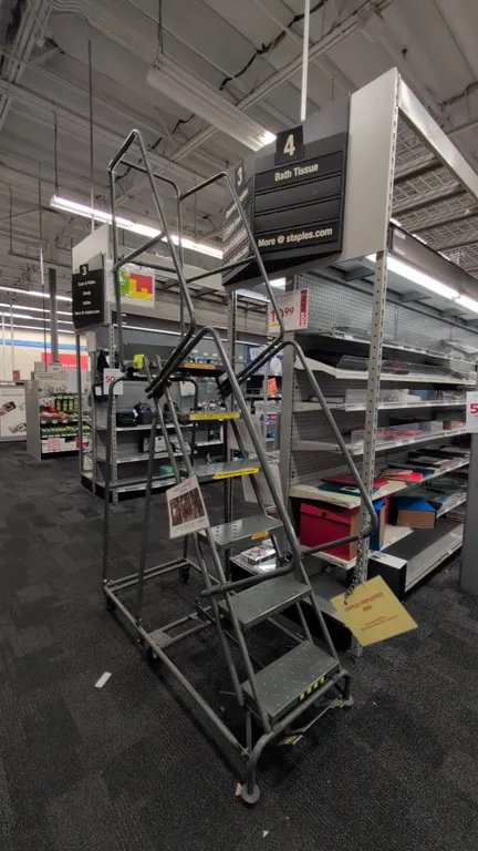 Metal rolling stock ladder. Features perforated slip-resistant treads, handrails, and upper safety guardrails. Dimensions: 24" x 56" x 101" (60"H top