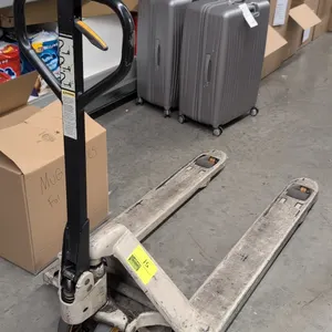 Crown PTH50 27-48 manual pallet jack. Features a 5,000 lb capacity, 3-position hand control lever, dual steer wheels, and entry rollers. S/N: 7-754372