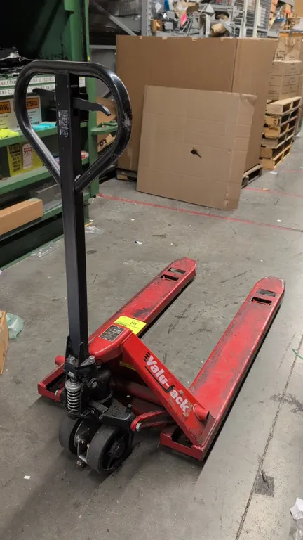 Valu-Jack VJ 6600 manual hydraulic pallet truck. Features a 6,600 lb load capacity, loop handle with 3-position lever control, and dual front entry ro