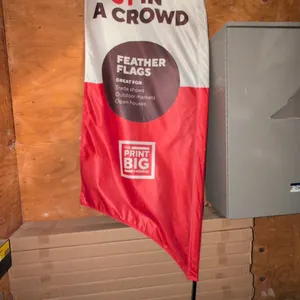 Curved sign stand with feather flag banner. Features multi-piece pole with flexible curved top and tension cord. Includes printed fabric feather flag 