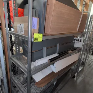Metal 4-tier rack cart. Features expanded metal shelves and integrated tubular push handles. 68"L x 21"W x 70"H. Mounted on casters. Contents not incl