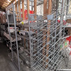 Assorted metal merchandise display racks. Includes (1) multi-tier wire pocket rack with header frame, (1) tiered angled wire display rack, and (1) mul