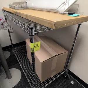 Metal 2-tier wire utility cart. Features chrome finish and two wire shelves. 42"L x 24"W x 38"H. Mounted on swivel casters. Contents not included.