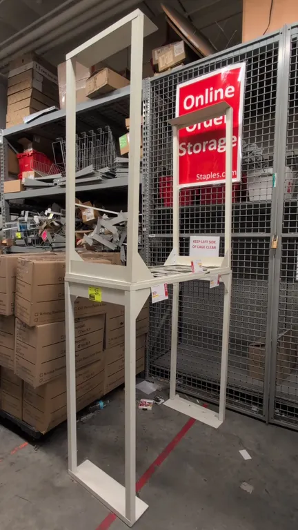 Metal merchandise racks. Features painted steel frame construction and wire grid shelving. Dimensions: 46" x 21" x 49".