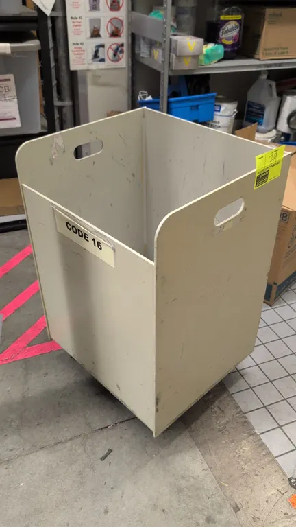 Poly portable container. Features open-top design with lower front access panel and cutout side handles. Off-white finish. 19" x 29"H. Mounted on cast