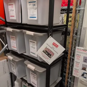Metal 4-tier shelving rack. Features black metal construction with four storage shelf levels. Dimensions: 36"x18"x72". Contents not included.