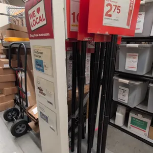 Assorted retail sign stands. Includes (1) freestanding floor directory tower display with slot inserts and weighted base, and multiple upright metal p