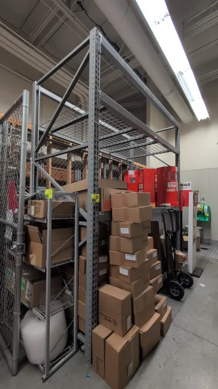 8'L section of Madix metal teardrop pallet racking. Features 3-1/2" crossbars and wire decks. Dimensions: 4'W x 10'H. Contents and hand truck not incl