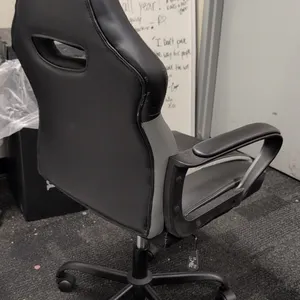 Vector 61108 ergonomic office chair. Features black and gray faux leather upholstery, padded armrests, integrated headrest cushion, tilt tension contr