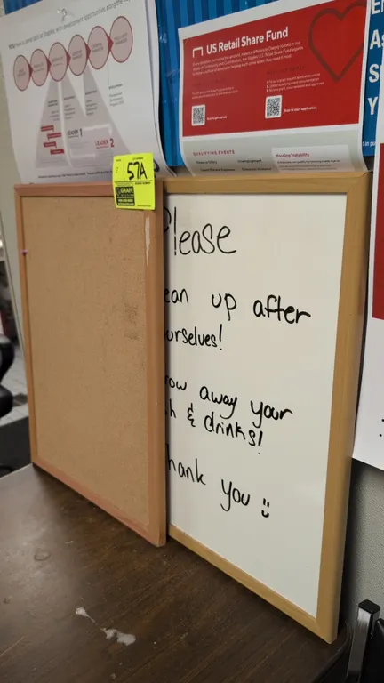 Staples wood-framed cork bulletin board and dry-erase whiteboard. Features natural wood-finish frames. 17" x 23" each.