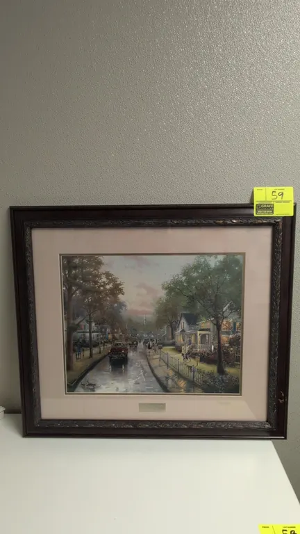 A Thomas Kinkade "Home Interiors, 50th Anniversary" Framed Print. (Home Interiors, 2007) A Library Edition commemorative art print by Thomas Kinkade d