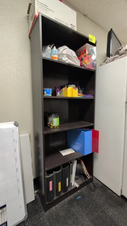 Laminate wood 5-tier bookshelf. Features dark brown finish and adjustable shelves. 28"W x 12"D x 72"H. Contents not included.