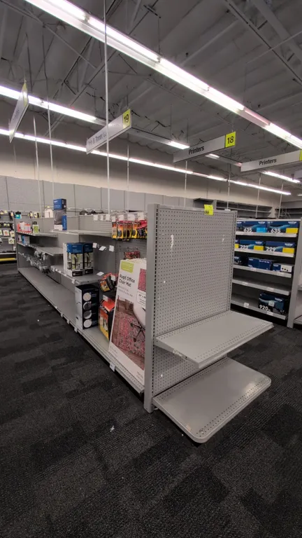 43'L of Madix gondola shelving. 60"H uprights with 18"/18" base shelves. Features gray finish, pegboard backing, and adjustable upper shelves. Content