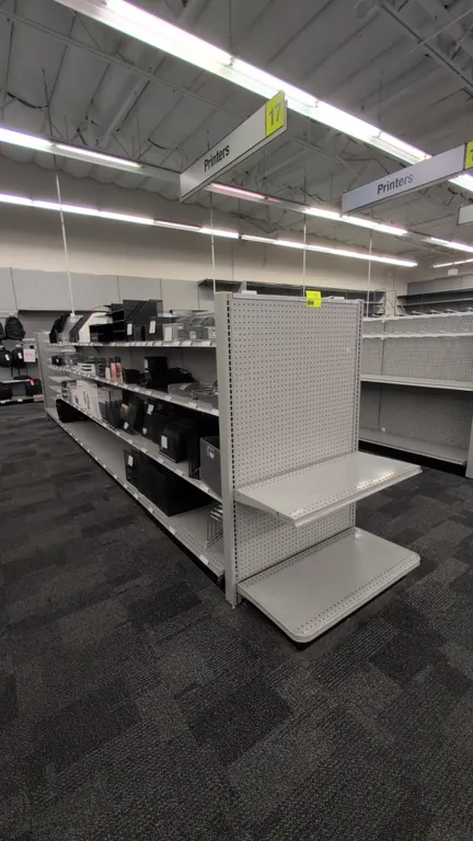 43'L of Madix gondola shelving. 60"H uprights with 18"/18" base shelves. Features gray finish, adjustable upper shelves, and pegboard backing. Content