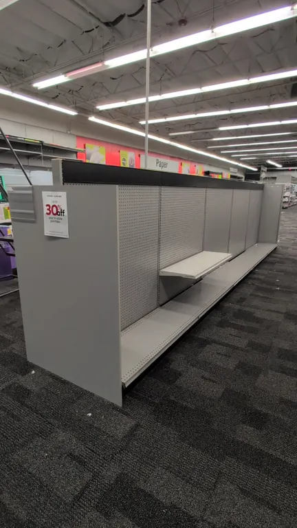 43'L of Madix gondola shelving. 60"H uprights with 18"/18" base shelves. Features gray finish, pegboard backing, and upper shelves. Note: Sold by the