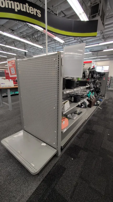 38'L of Madix gondola shelving. 60"H uprights with 18"D double-sided base shelves. Features gray finish, adjustable upper shelves, pegboard and solid