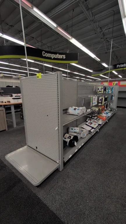 38'L of Madix gondola shelving. 60"H uprights with 18"/18" base shelves. Features gray finish with pegboard backing. Contents not included. Note: Sold