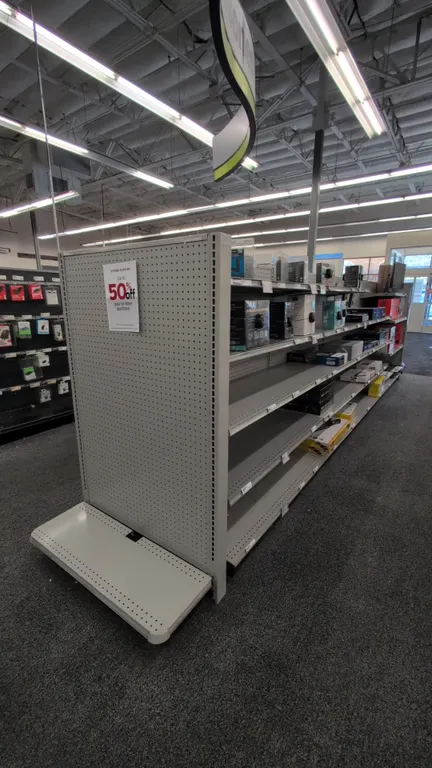 38'L of Madix gondola shelving. 60"H uprights with 19"/19" base shelves. Features gray finish, pegboard backing, adjustable upper shelving, and displa