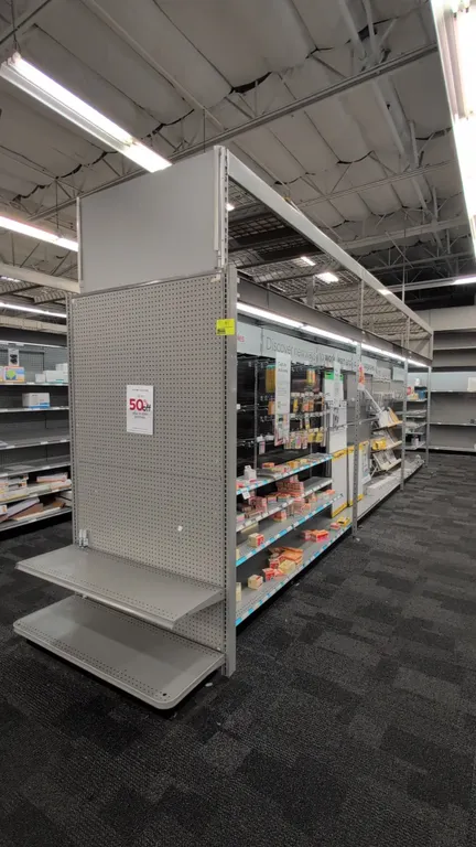 52'L of Madix gondola shelving. 108"H uprights with 18"D base shelves. Features grey finish, pegboard backing, adjustable upper shelves, integrated ov