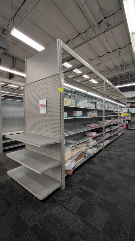 52'L of Madix gondola shelving. 108"H uprights with 18"D double-sided base shelves. Features gray finish, pegboard backing, adjustable upper shelving,