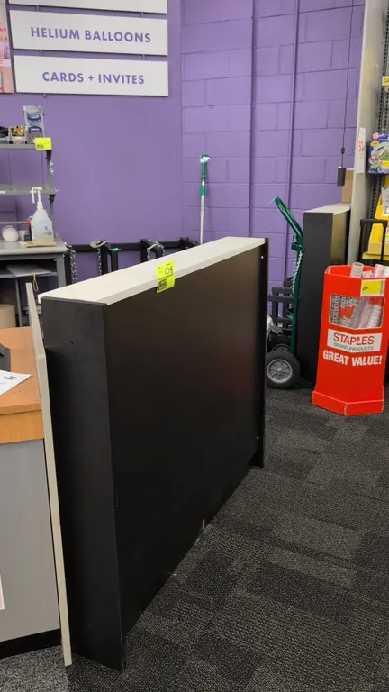 Laminate partition barriers. Features black laminate construction with contrasting light-colored top cap. 50" x 42".