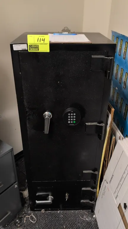 Metal commercial security safe. Features two-compartment design, upper door equipped with a LA GARD digital electronic keypad lock, and lower compartm