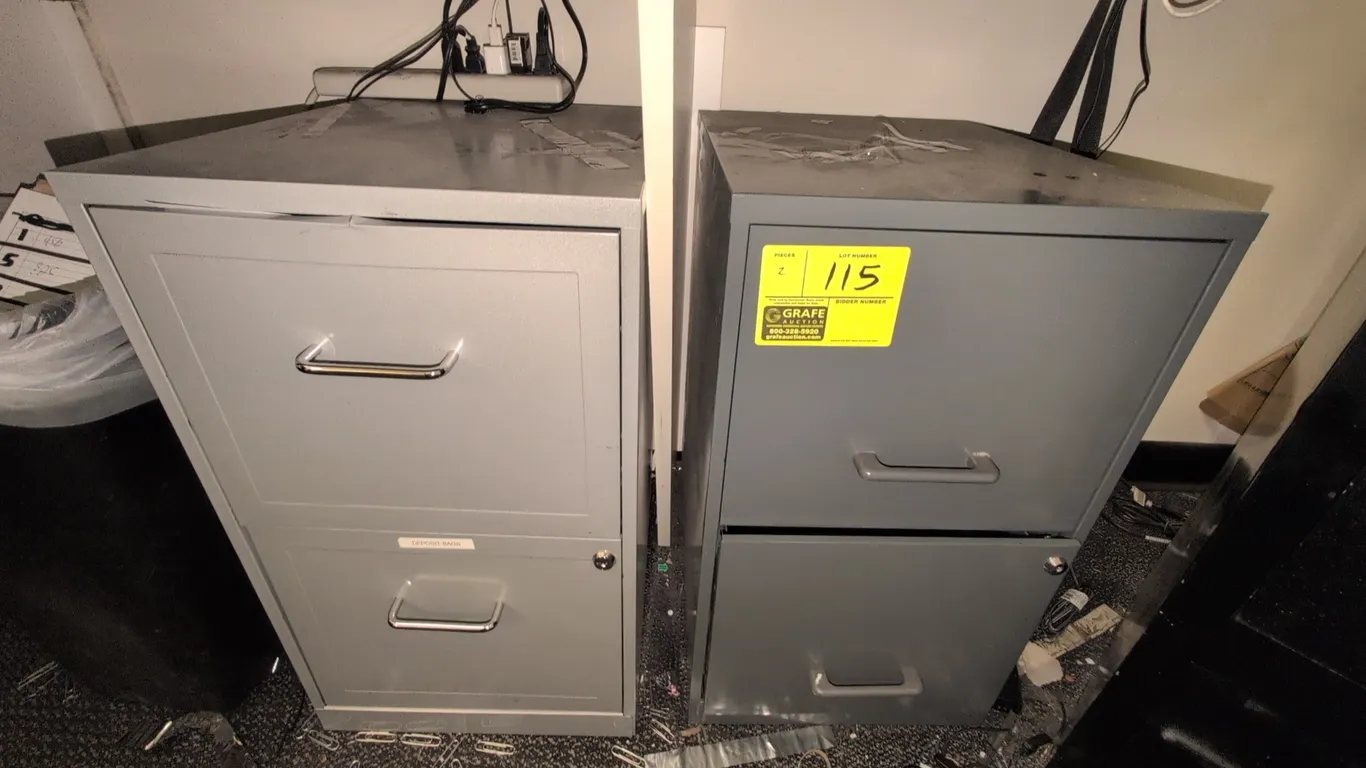 Metal 2-drawer vertical filing cabinets. Features metal construction, pull handles, and integrated lock cylinders. 14" x 24"H. Keys not included.