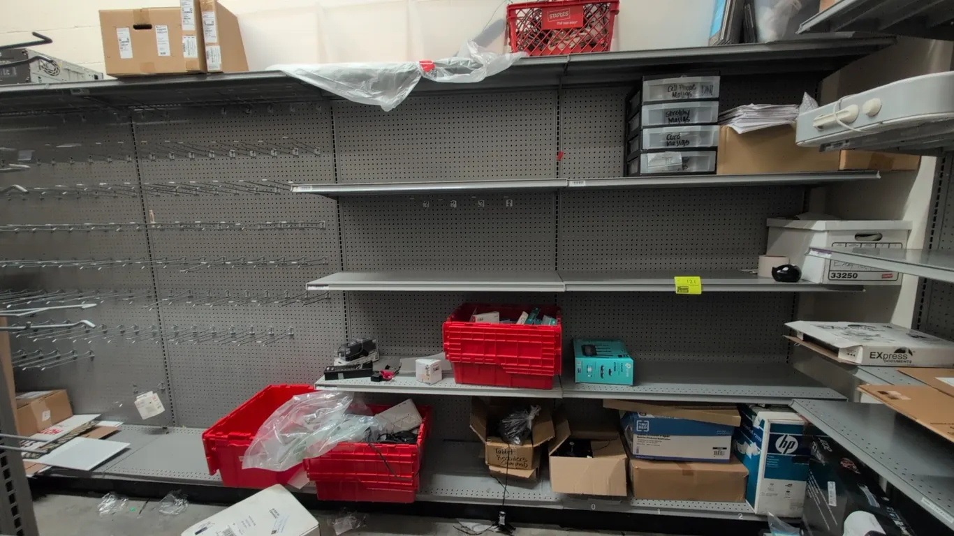 16'L of Madix wall shelving. 78"H uprights with 18"D base shelves. Features gray finish, pegboard backing, and adjustable shelves. Contents not includ