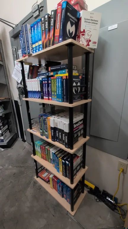 5-tier bookshelf. Features wood-tone laminate shelves with black tubular metal uprights and side support rails. 27"L x 12"W x 60"H. Contents not inclu