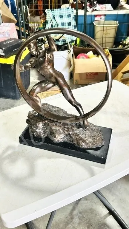 Wheel man resin sculpture - 12" wide x 15" tall