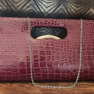 Burgundy crocodile-embossed clutch bag