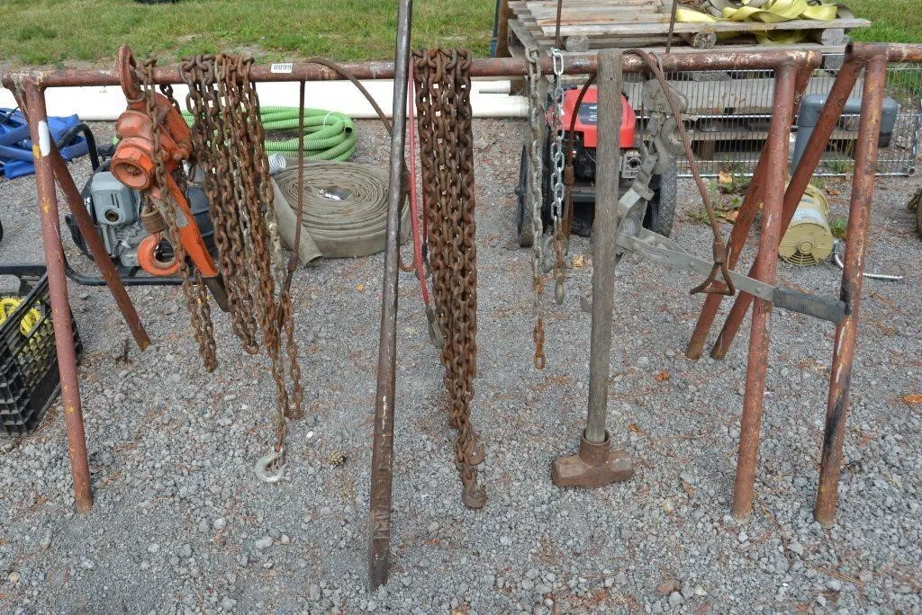 Metal bar with assorted chains and cables