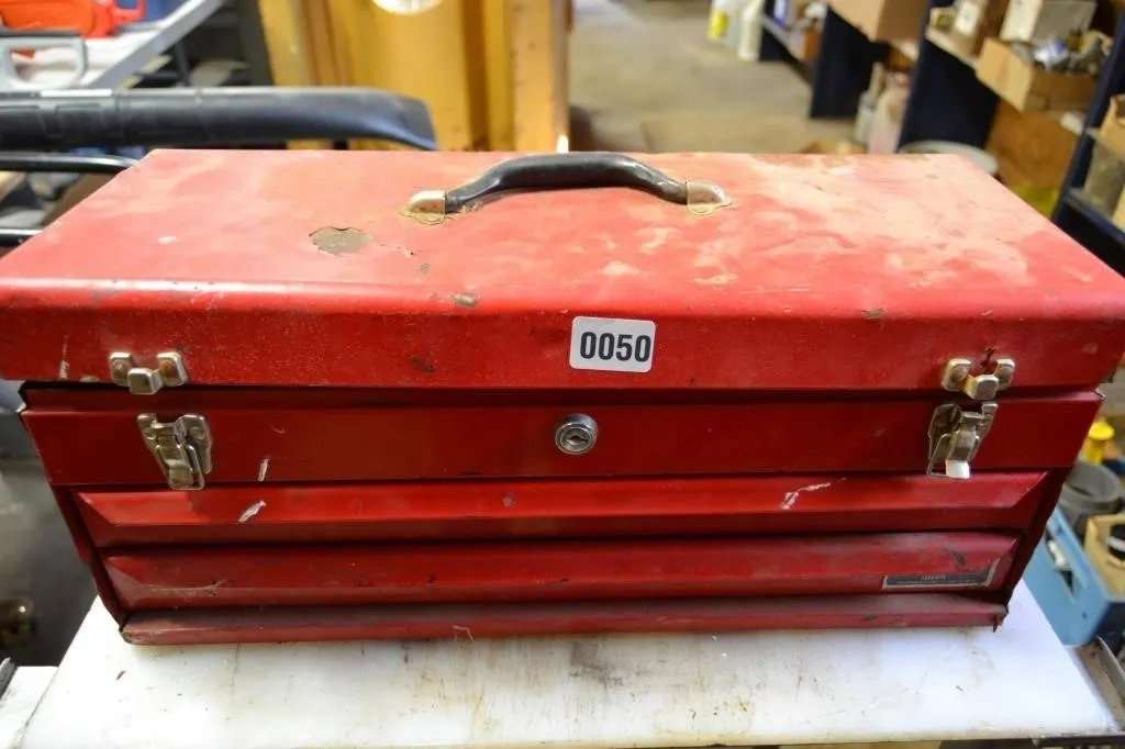 Red tool box with assorted tools