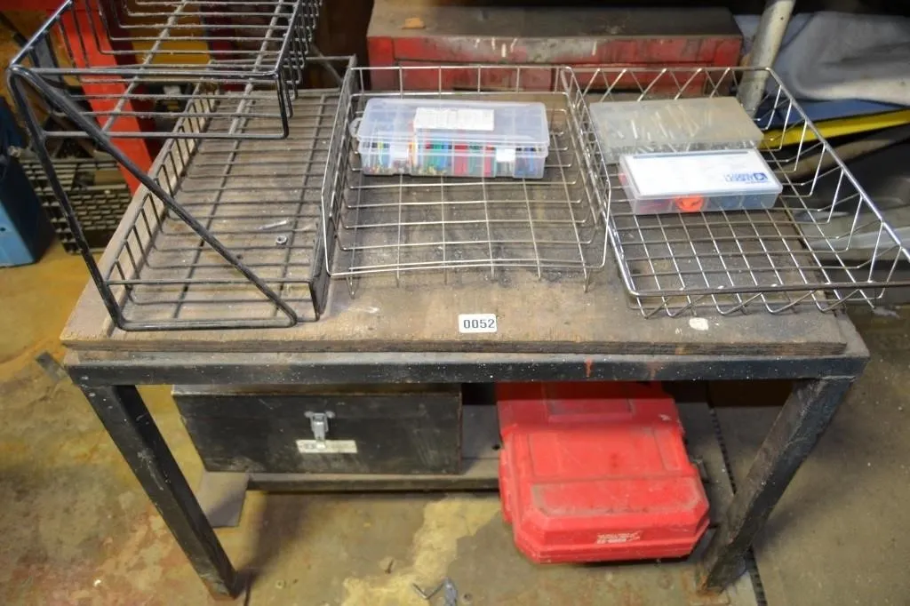 Table with wired racks and cases