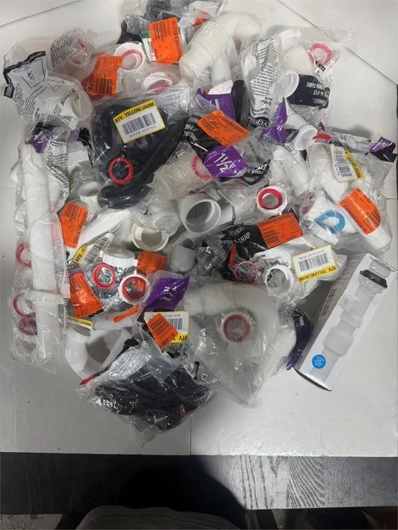 Mixed Lot Of Everbilt P-Traps And Drain Fittings