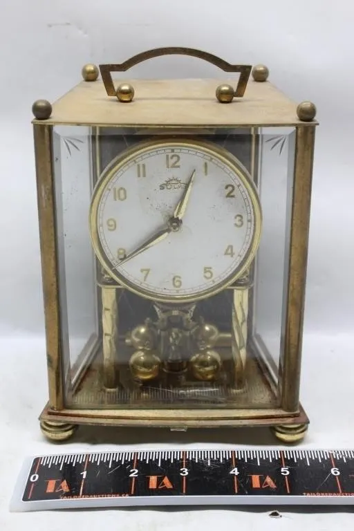 Solar brass carriage clock with pendulum, glass