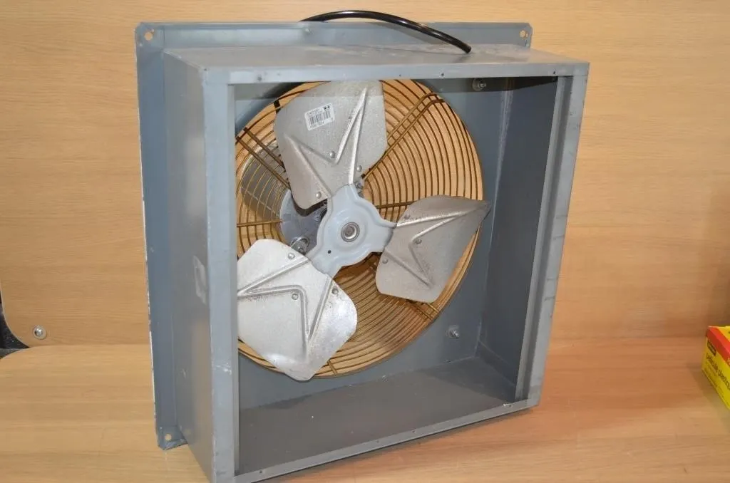 Metal industrial panel exhaust fan with a