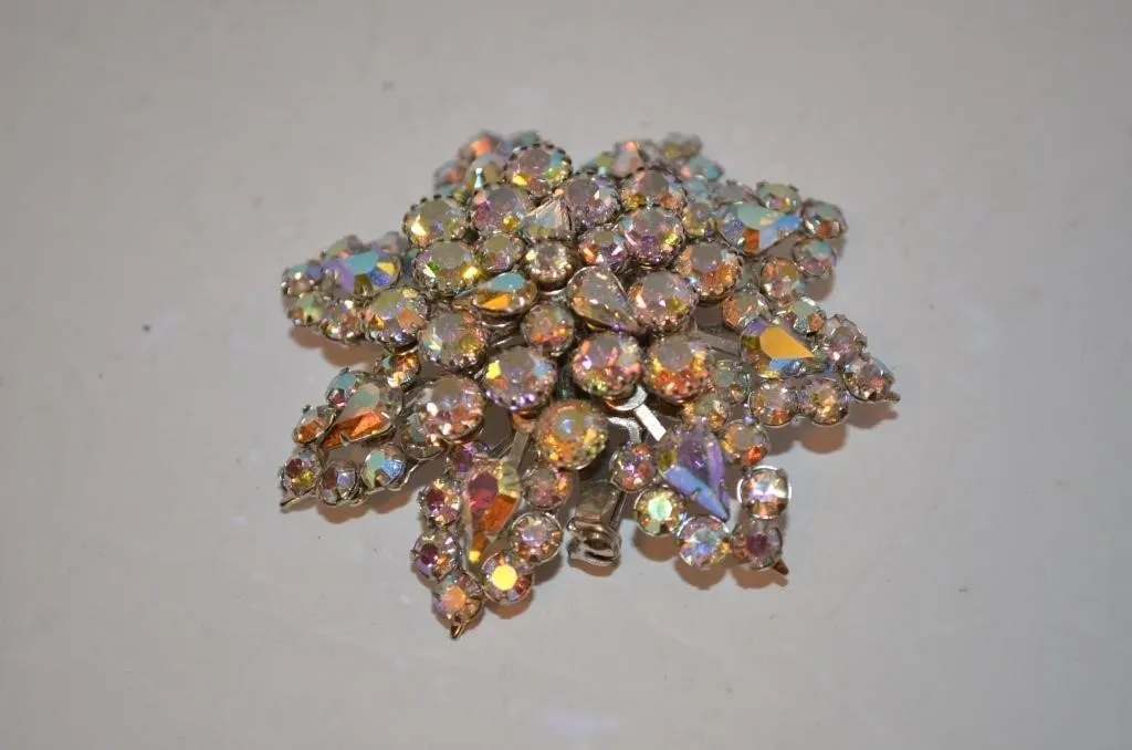 Vintage multi-layered rhinestone brooch featuring