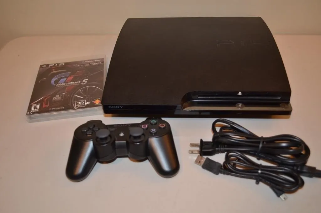 Black Sony PlayStation 3 Slim console bundle clean