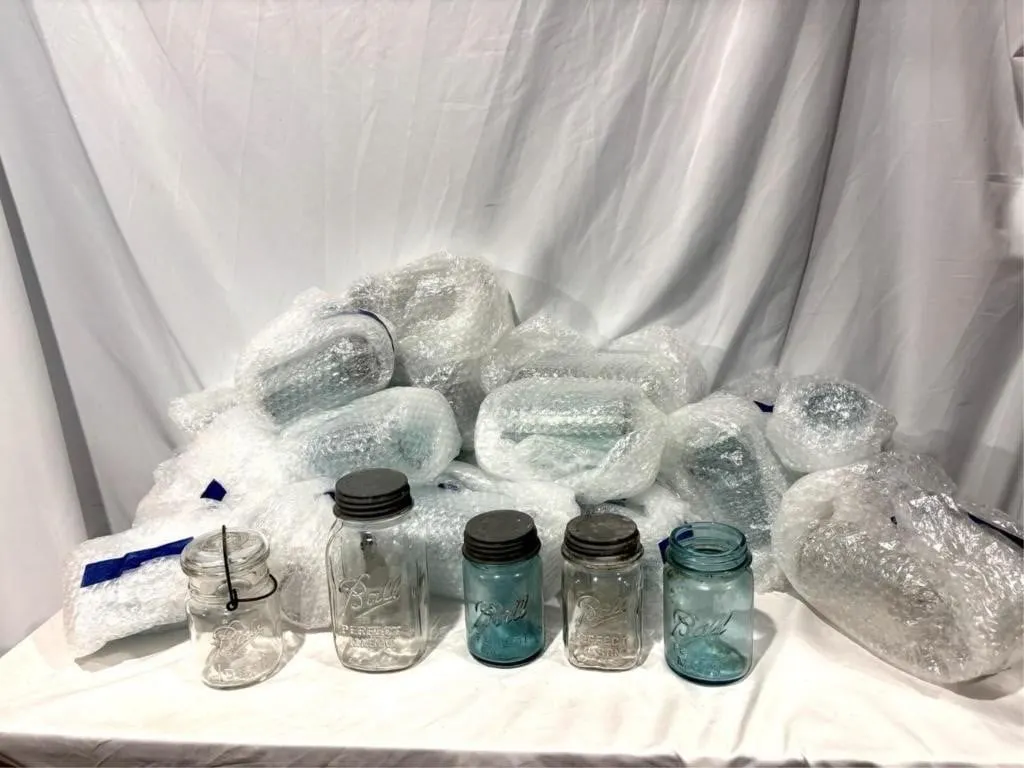 Ball jars, mostly blue and some clear