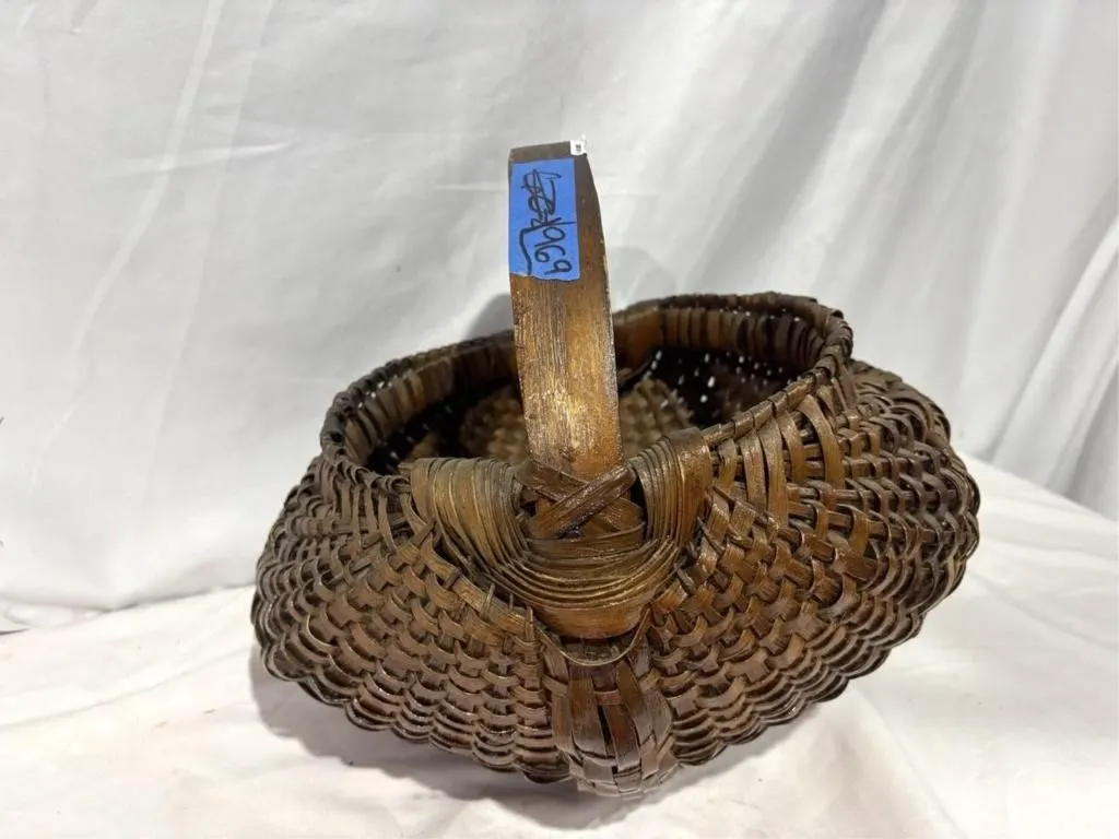 Hand woven basket with wooden handle