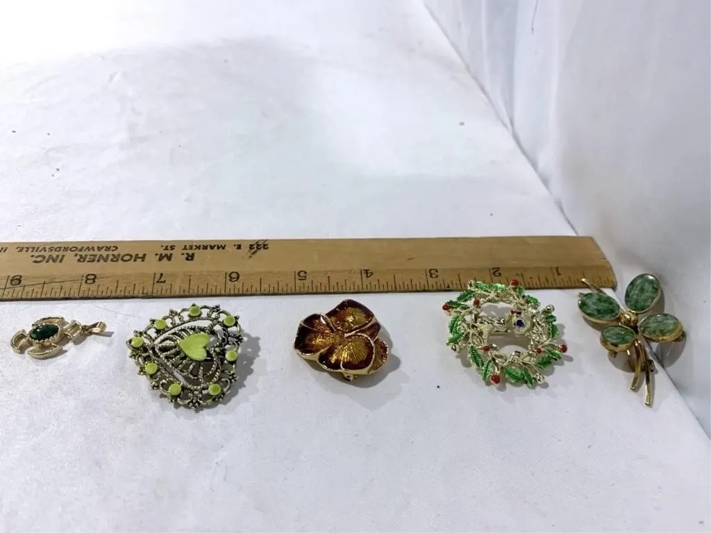 Vintage costume brooches and Avon pendent