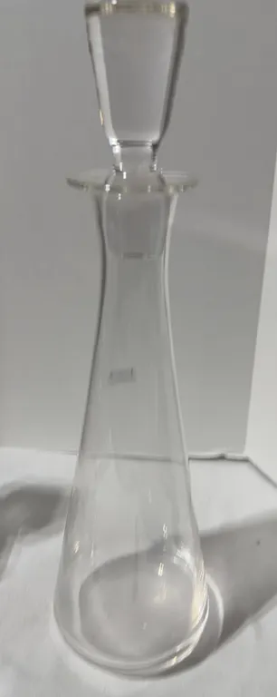 Vintage crystal barware by Waterford Crystal. 16” tall, clear glass decanter with a matching stopper