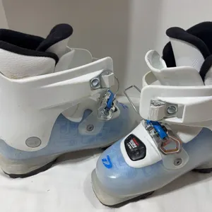 Pair of white and transparent blue Dalbello Gaia 2.0 junior girls' ski boots