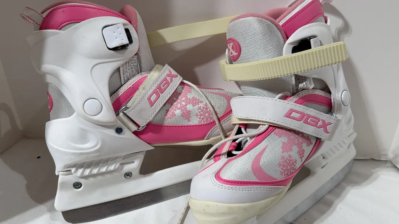 Pair of white and pink DBX adjustable youth ice skates size 3-6