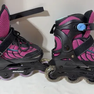 Pair of black and pink Schwinn adjustable 2-in-1 quad and inline skates size 1-4