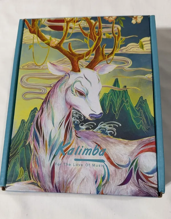A 17-key kalimba thumb piano in a decorative blue box
