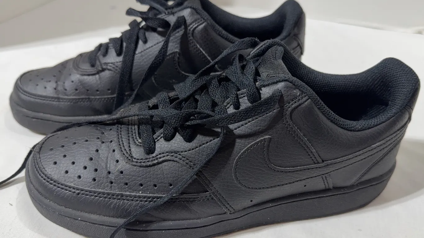 Pair of black Nike Court Vision Low sneakers Size 6.