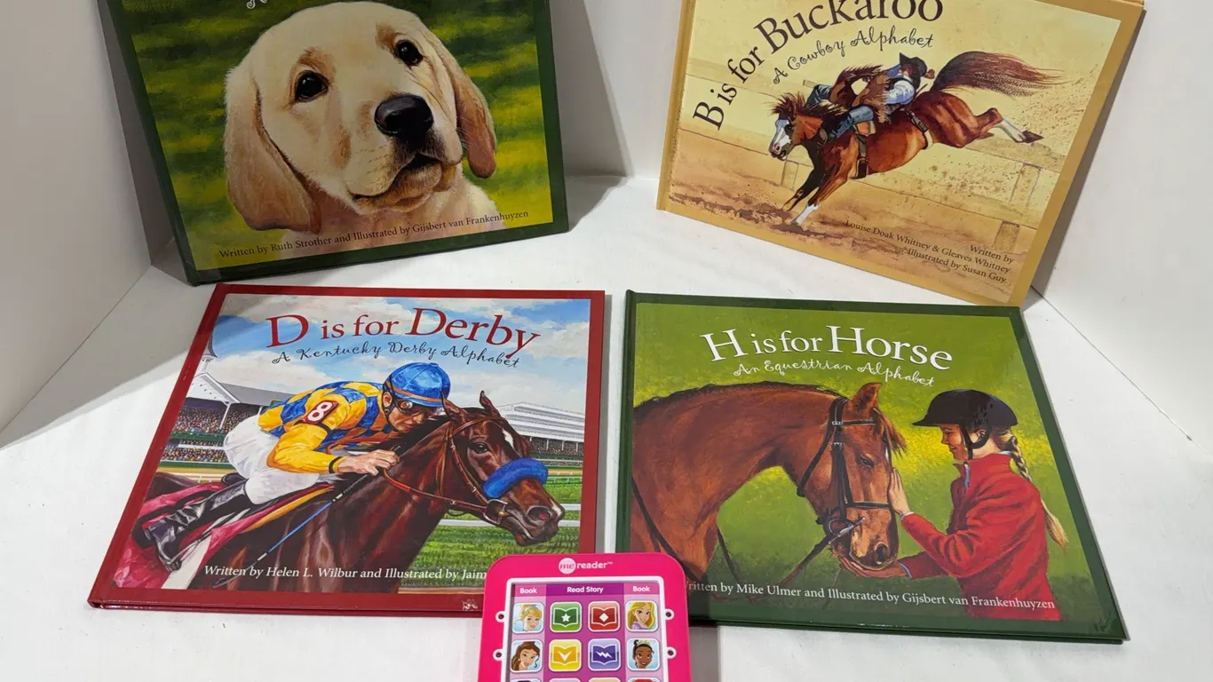 Lot of four alphabet books and a Me reader
