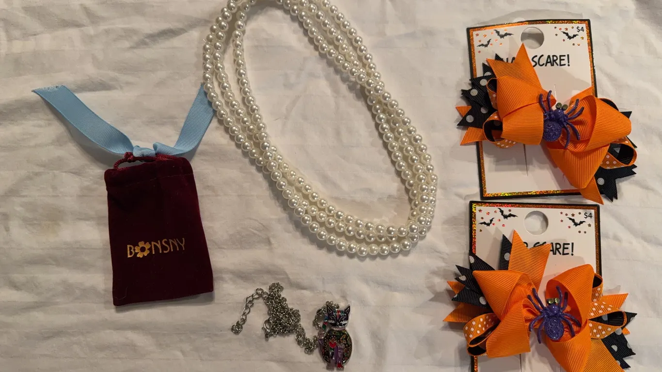 Pair of necklaces and a pair of Halloween hair bows